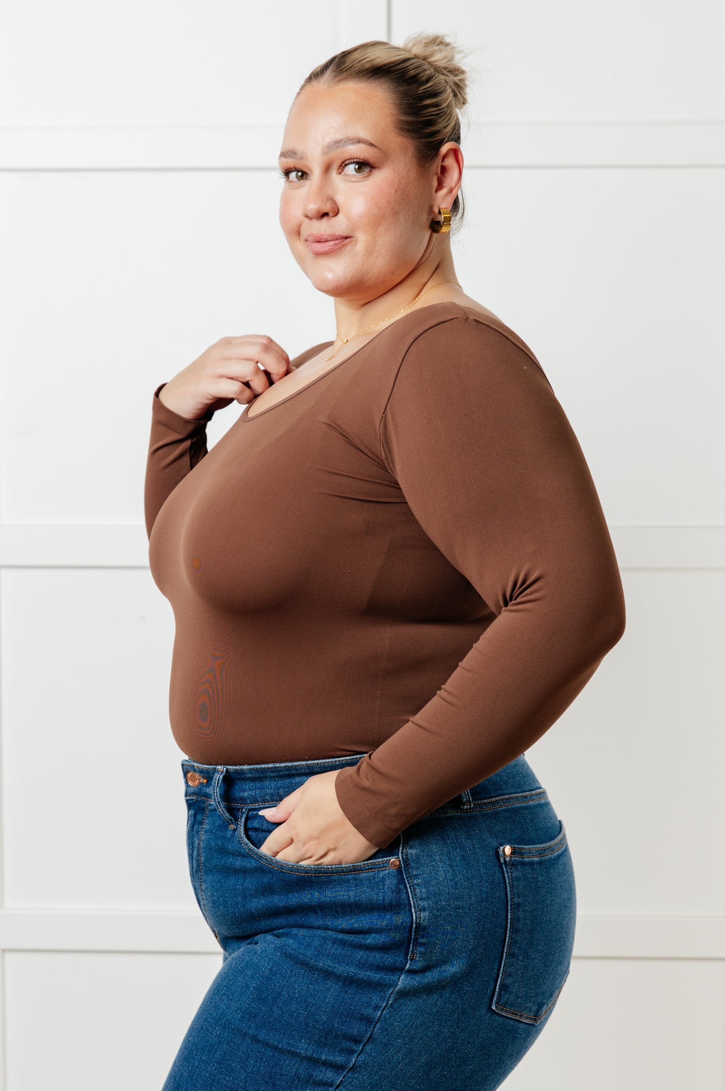 Coffee colored brushed microfiber reversible top with a scoop or V-neckline, long sleeves, and a form-fitting silhouette.