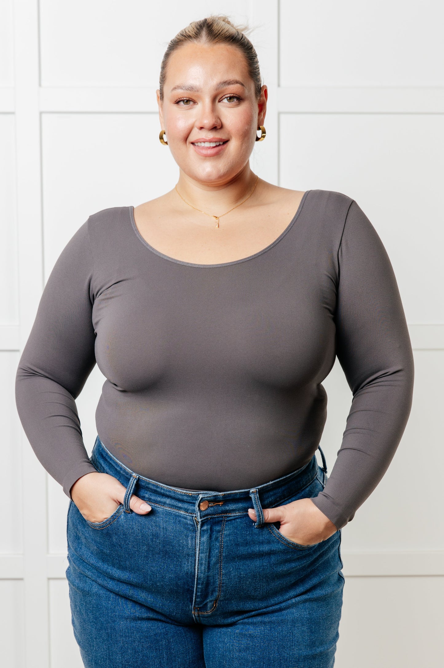 Charcoal long-sleeve reversible top with a scoop and V-neckline, made from soft brushed microfiber in a form-fitting silhouette.