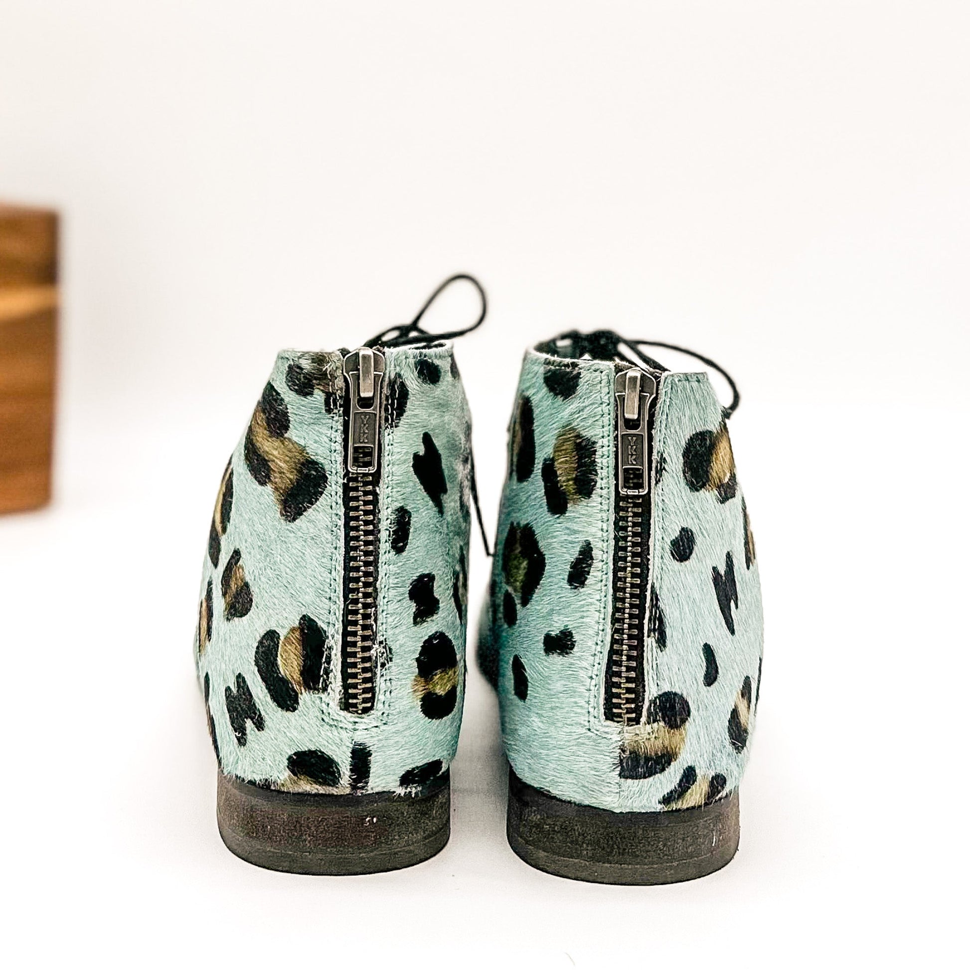 Back view of Nola Teal Leopard Sandals showing zipper closure and teal leopard print.