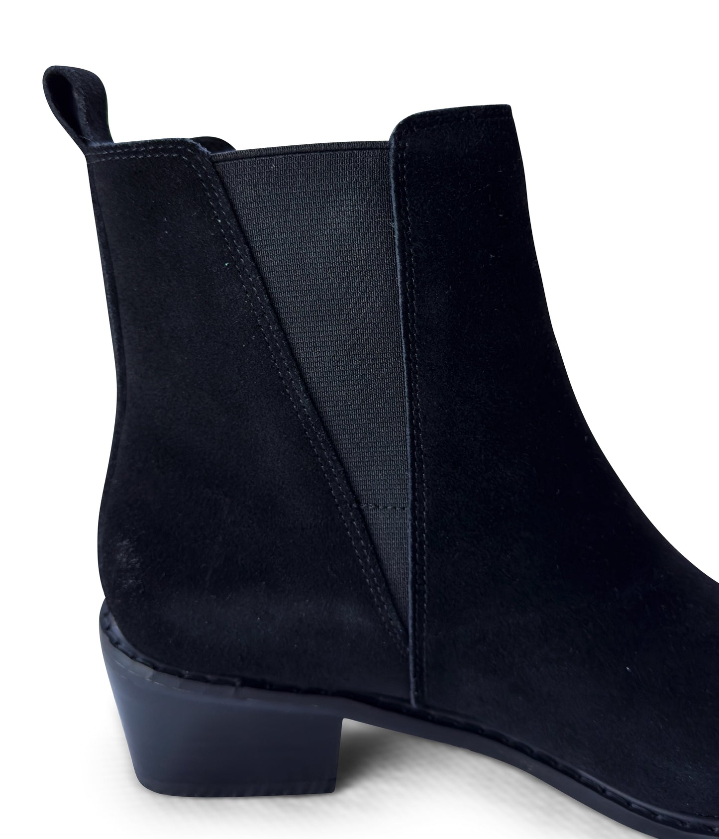 Women's black ankle booties made of genuine suede with a leather lining, featuring a slight pointed toe with a silver accent, 1.5-inch heel, pull-on style with elastic side panels and a pull tab. 