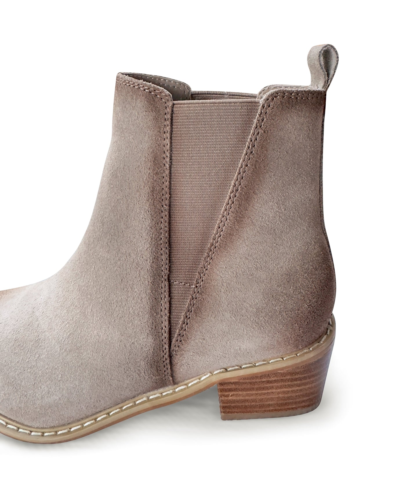 Women's taupe ankle booties made of genuine suede with a leather lining, featuring a slight pointed toe with a silver accent, 1.5-inch heel, pull-on style with elastic side panels and a pull tab. 