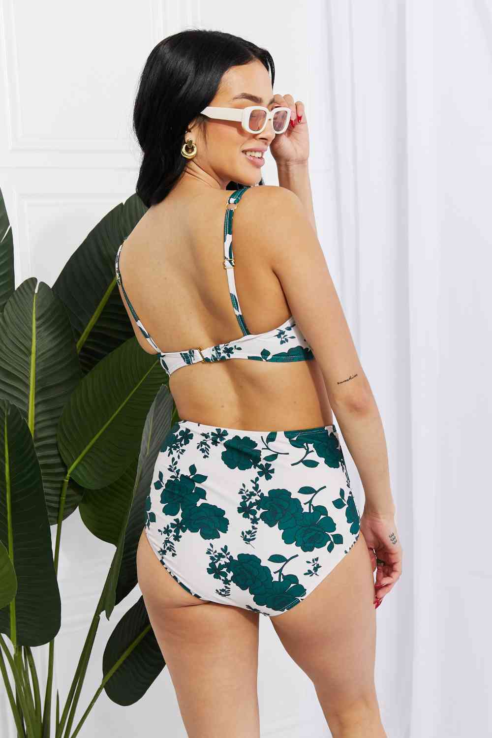 Back view of the Forest high-waisted bikini with a twist-front top and high-rise bottoms, showing off the simple yet elegant design. The bikini offers removable padding for a customized fit.