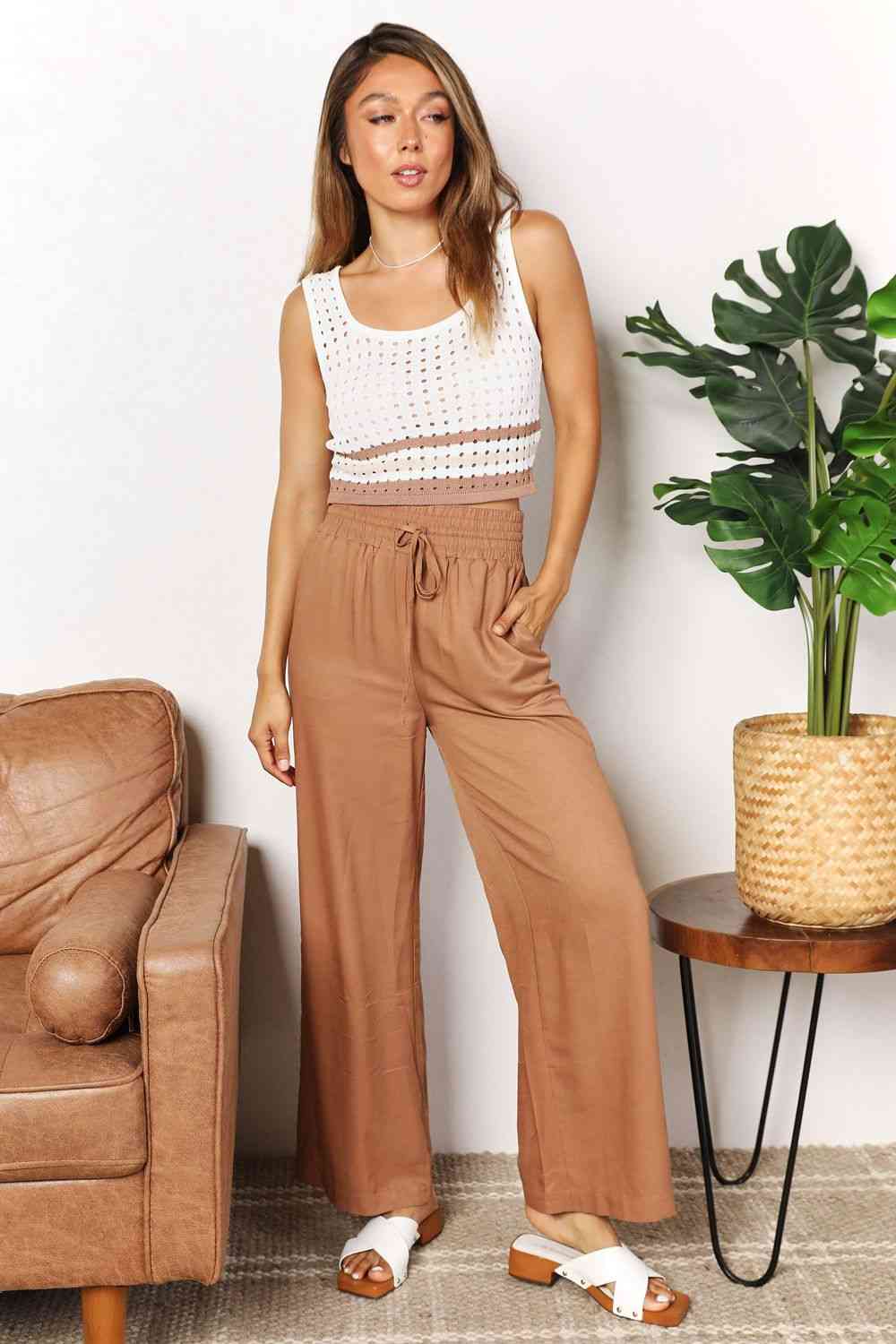 Camel colored, wide-leg pants with a drawstring-smocked waist.