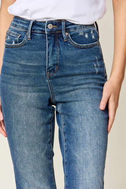 Judy Blue High Waist Slim Jeans in dark denim, featuring tummy control, a zip fly, and a flattering, highly stretchy fit. It has a slim, long leg and high waist.