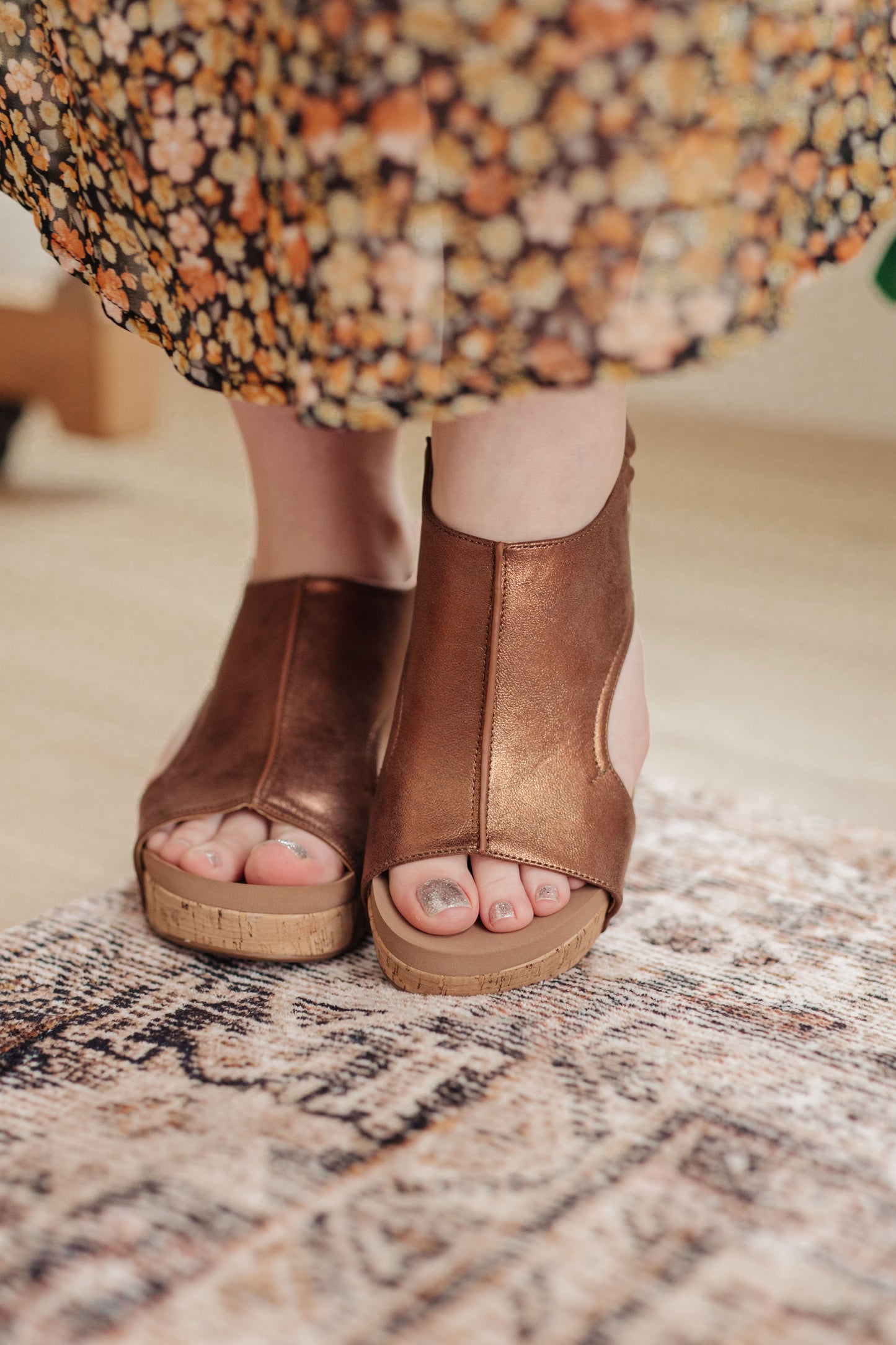 Antique bronze wedge sandals with stud detail, faux leather upper, and memory foam insole for comfort and style.